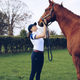 Irish rider Alex Calder wearing her go-to Sakkara breeches with her thoroughbred horse, Ben.